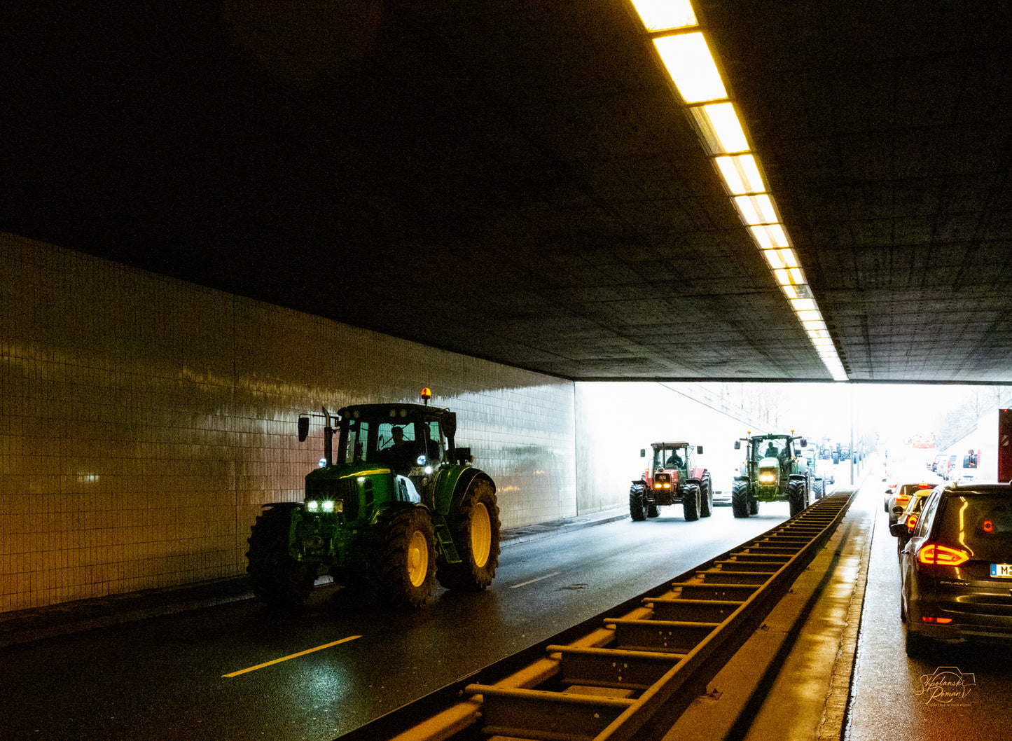 Light streaking through a long tunnel toward the exit