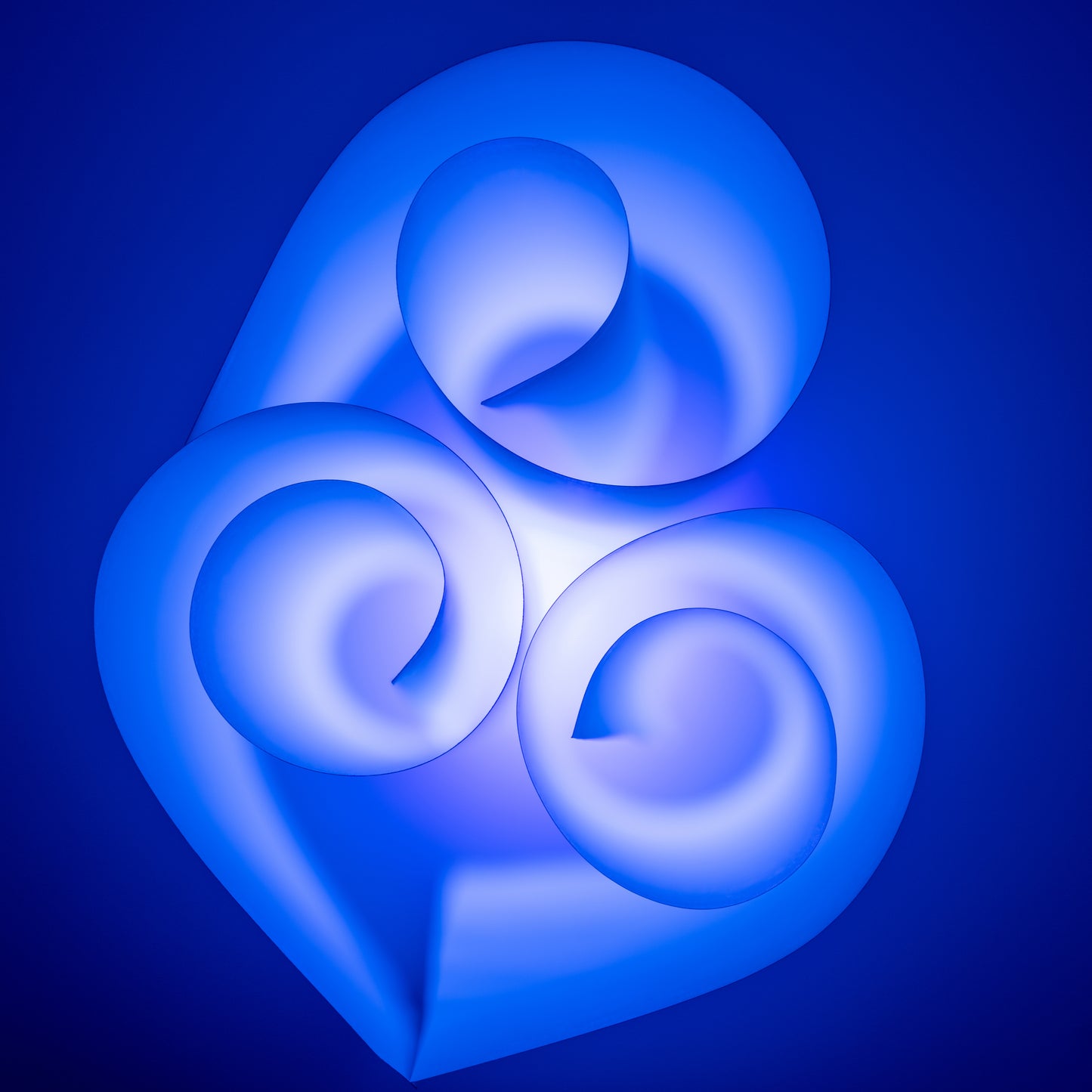 Whirlwind of time. Spiraled Paper: Illuminated with UV-Light. Digital picture.