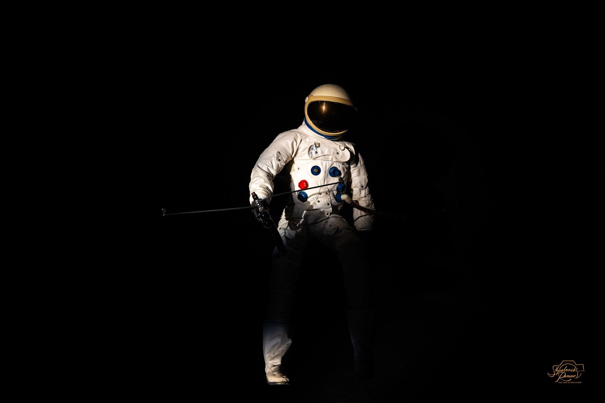 Astronaut spacesuit lit against a black background