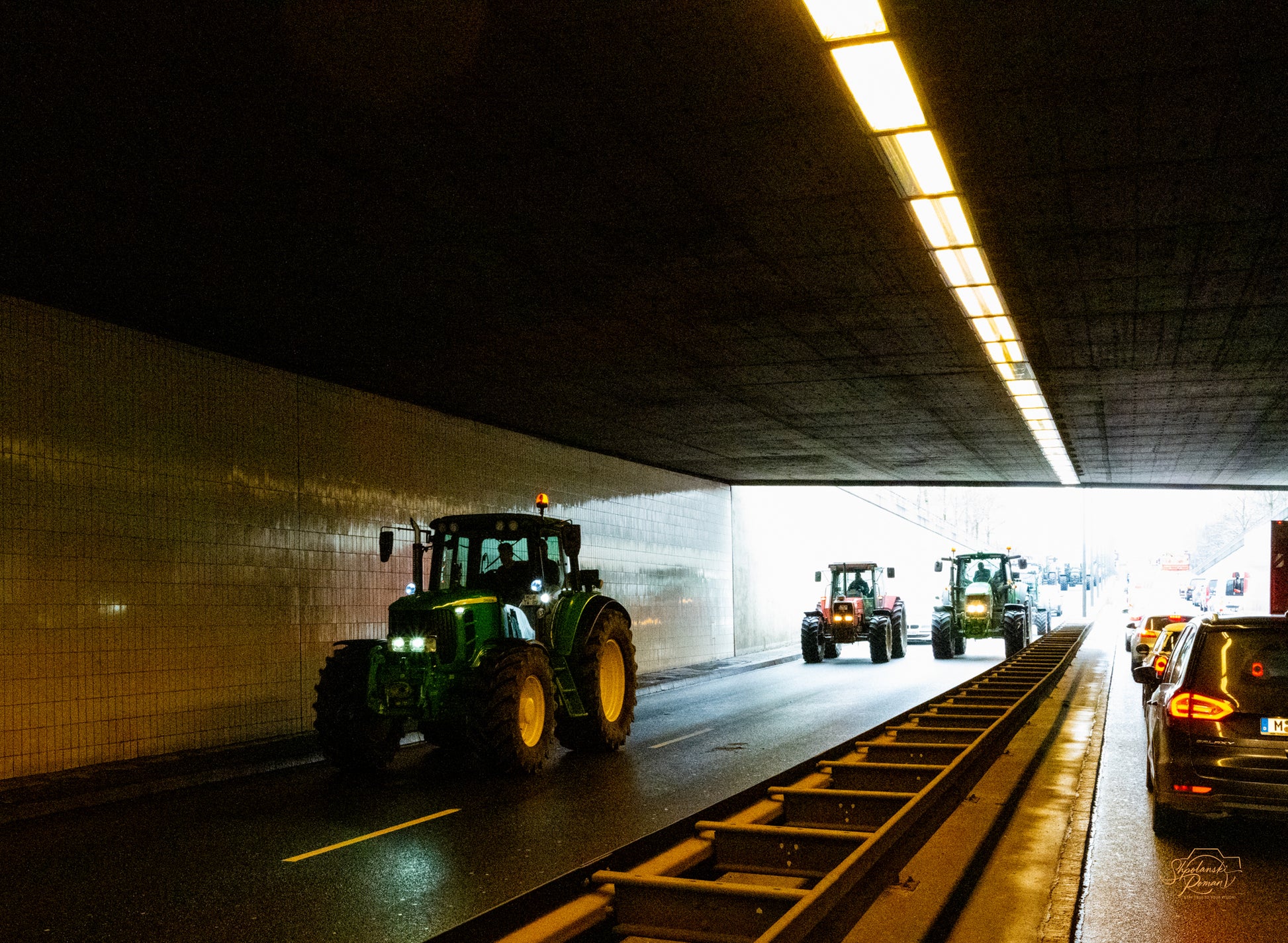 Light streaking through a long tunnel toward the exit