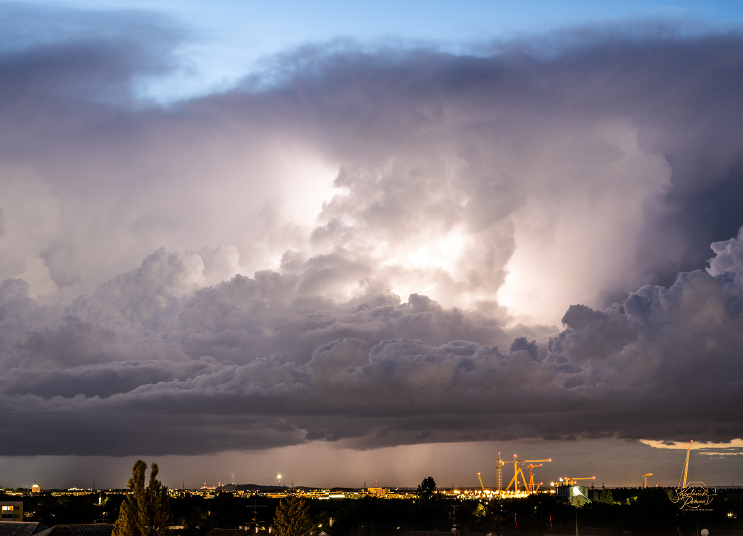 Dramatic storm clouds over a city skyline
