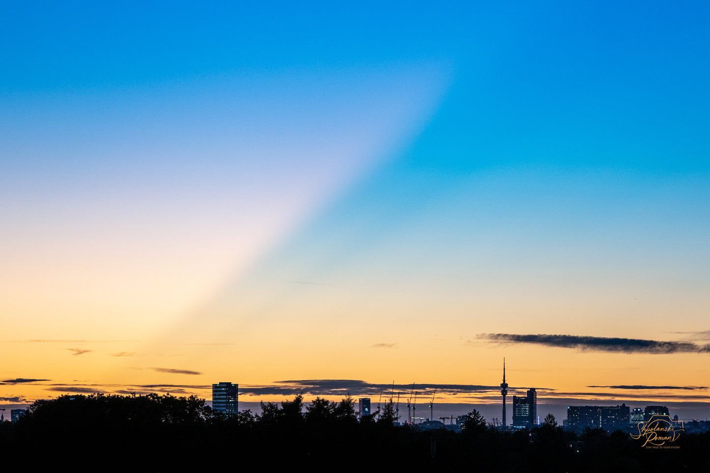 Munich skyline at dusk under a colourful gradient sky